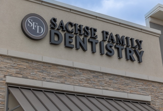 Outside of Sachse Family Dentistry at Woodbridge building