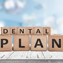 Blocks spell “dental plan”