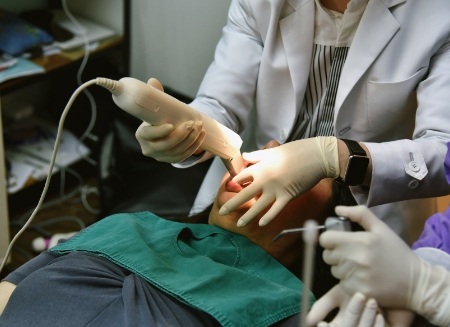 Dentist capturing digital dental impressions of a patient