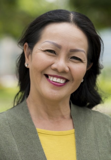 Woman smiling outdoors with dentures in Sachse