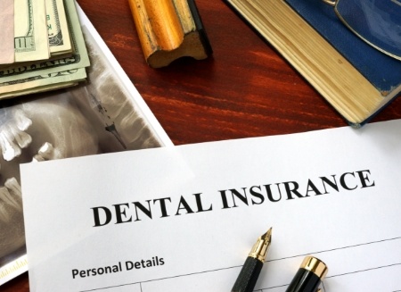 Dental insurance form on wood desk