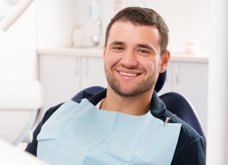 Young man smiling in dental chair