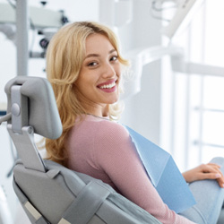 Closeup of smiling patient sitting in treatment chair