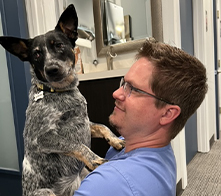 Doctor Rottman holding an Australian Cattle Dog