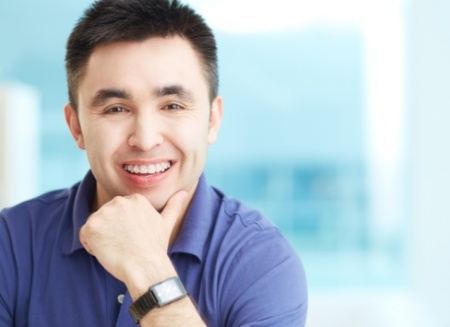 Young man smiling with traditional braces