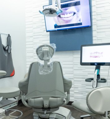 woman holding invisalign
