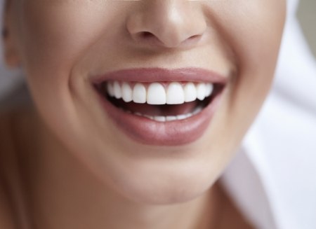 Person smiling with straight white teeth