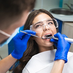  A woman at the dentist getting a root canal