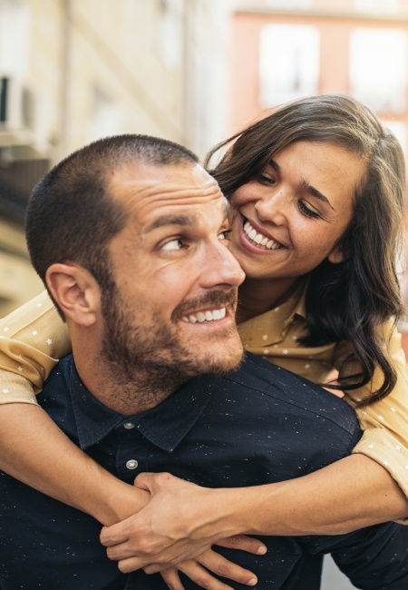 Man and woman smiling together