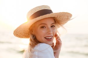 Woman at beach after seeing cosmetic dentist in Sachse