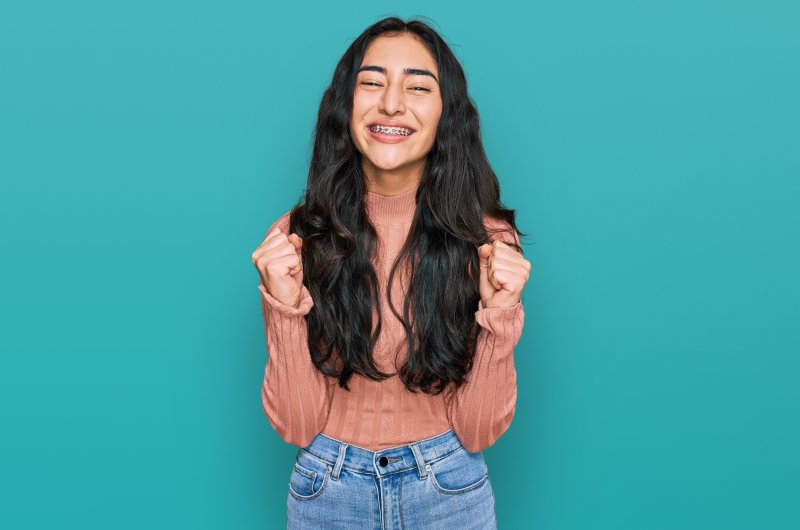 person smiling after having broken braces repaired