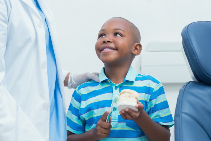 kid thinking of facts about teeth in Sachse