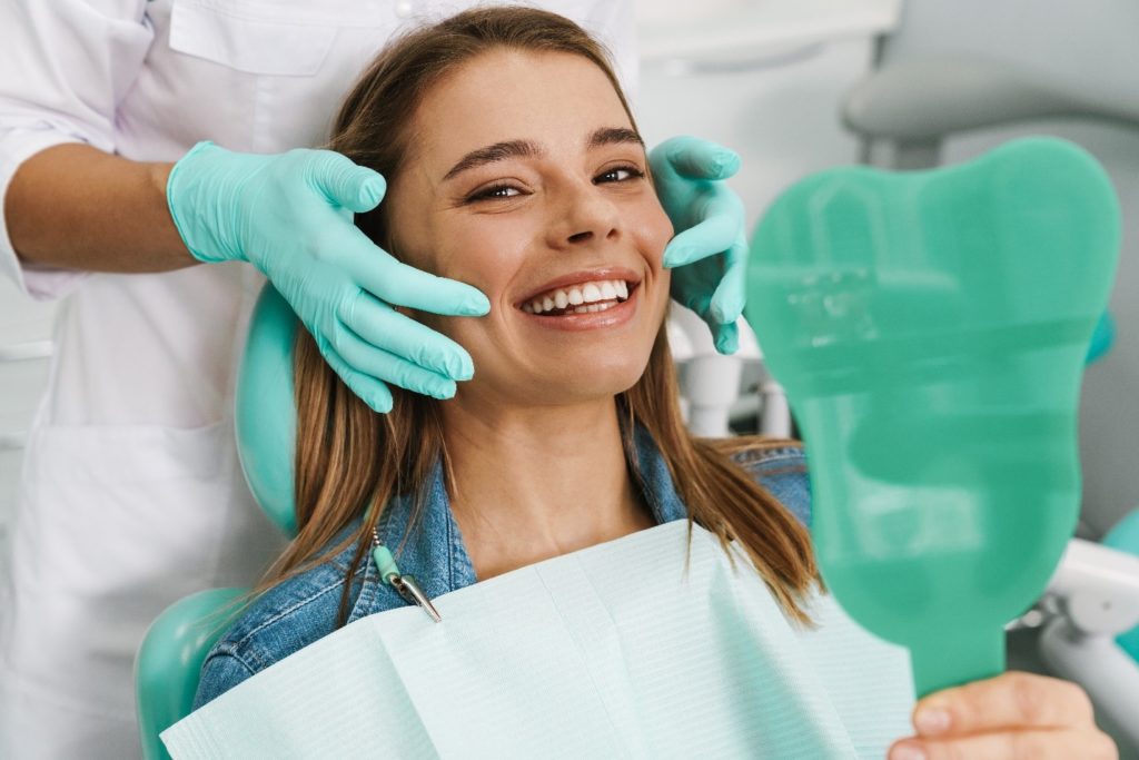 Young girl with dental bonding smiling