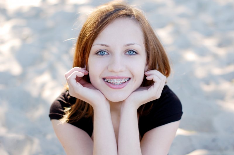 person smiling with braces