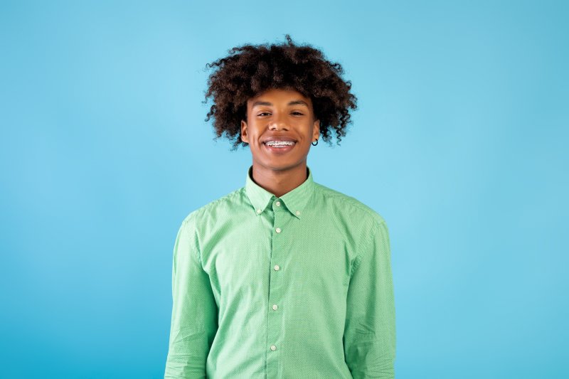 A man smiling with his second pair of braces