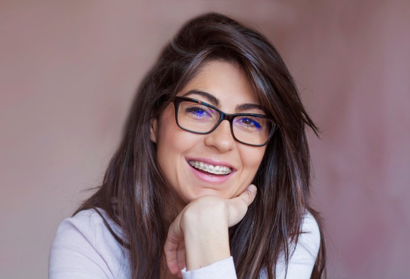 young girl with glasses wearing braces